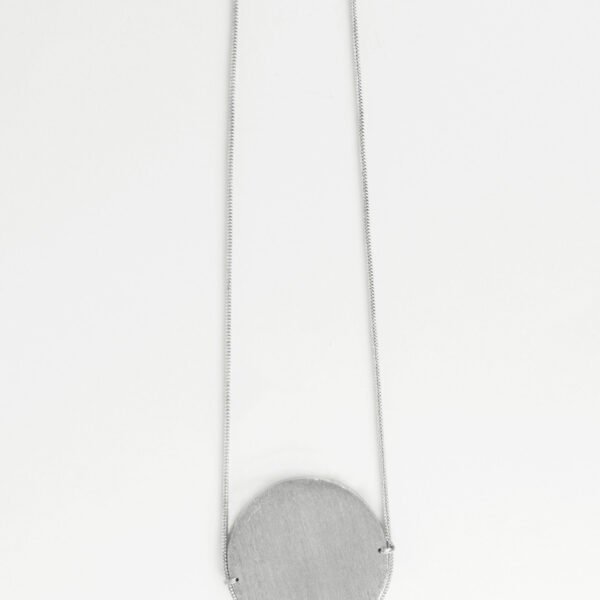 long silver necklace with silver medallion