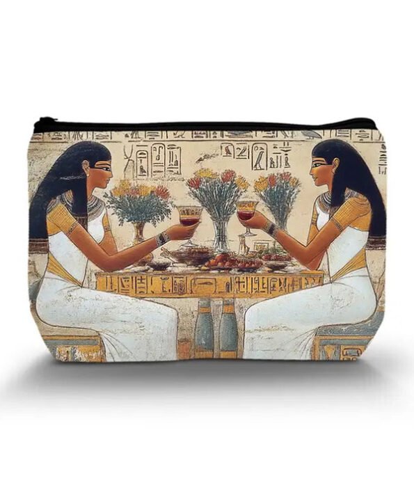 Egyptian print cosmetic bag with two ladies having wine. Colors are brown, black and white.